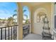 Community view from private patio with arched entryway at 1605 Napoli W Dr, Sarasota, FL 34232