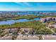Aerial view of community near the waterfront with lush greenery at 1719 Starling Dr # 1719, Sarasota, FL 34231