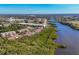 Aerial view of community and surrounding waterfront landscape at 1719 Starling Dr # 1719, Sarasota, FL 34231