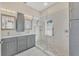 Modern bathroom with double vanity and walk-in shower at 1719 Starling Dr # 1719, Sarasota, FL 34231