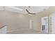 Bright bedroom with ceiling fan and access to bathroom at 1719 Starling Dr # 1719, Sarasota, FL 34231