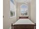 Bright bedroom with double bed and plantation shutters at 1719 Starling Dr # 1719, Sarasota, FL 34231