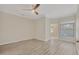 Bright bedroom with wood-look floors and ceiling fan at 1719 Starling Dr # 1719, Sarasota, FL 34231