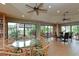 Bright community room with seating areas, bookshelves, and large windows at 1719 Starling Dr # 1719, Sarasota, FL 34231