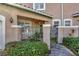 Front entry with wrought iron gate and brick walkway at 1719 Starling Dr # 1719, Sarasota, FL 34231