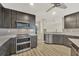 Modern kitchen with stainless steel appliances and an island at 1719 Starling Dr # 1719, Sarasota, FL 34231