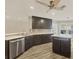 Modern kitchen with stainless steel appliances and an island at 1719 Starling Dr # 1719, Sarasota, FL 34231