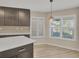 Modern kitchen with white countertops and dark cabinets at 1719 Starling Dr # 1719, Sarasota, FL 34231