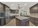 Modern kitchen with stainless steel appliances and an island at 1719 Starling Dr # 1719, Sarasota, FL 34231