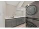 Laundry room with stacked LG washer and dryer at 1719 Starling Dr # 1719, Sarasota, FL 34231