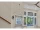 Spacious living room with high ceilings, hardwood floors, and large windows at 1719 Starling Dr # 1719, Sarasota, FL 34231