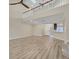 Two-story living room with hardwood floors and loft overlook at 1719 Starling Dr # 1719, Sarasota, FL 34231