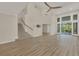 High-ceilinged living room with hardwood floors and access to screened porch at 1719 Starling Dr # 1719, Sarasota, FL 34231