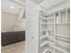 Well-organized pantry with ample shelving at 1719 Starling Dr # 1719, Sarasota, FL 34231