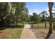 Brick pathway leads to a park with lush green space at 1719 Starling Dr # 1719, Sarasota, FL 34231