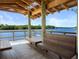 Enjoy the view from a waterfront pavilion with wooden benches at 1719 Starling Dr # 1719, Sarasota, FL 34231