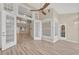 Sunroom with wood-look floors and access to the main living area at 1719 Starling Dr # 1719, Sarasota, FL 34231