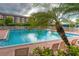 Refreshing community swimming pool with lounge chairs at 1719 Starling Dr # 1719, Sarasota, FL 34231