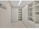 Spacious walk-in closet with custom built-ins at 1719 Starling Dr # 1719, Sarasota, FL 34231