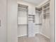 Large walk-in closet with ample shelving and drawers at 1719 Starling Dr # 1719, Sarasota, FL 34231