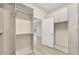 Spacious walk-in closet with built-in shelving and hanging space at 1719 Starling Dr # 1719, Sarasota, FL 34231