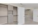 Spacious walk-in closet with built-in shelves and drawers at 1719 Starling Dr # 1719, Sarasota, FL 34231