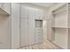 Large walk-in closet with ample shelving and hanging space at 1719 Starling Dr # 1719, Sarasota, FL 34231