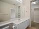 Bathroom boasts a vanity with drawers, a large mirror, and a walk-in closet at 1736 Burgos Dr, Sarasota, FL 34238