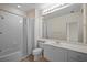 Clean bathroom with a bathtub, toilet and vanity with a mirror at 1736 Burgos Dr, Sarasota, FL 34238