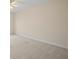 Large carpeted bedroom with neutral walls and ceiling fan at 1736 Burgos Dr, Sarasota, FL 34238
