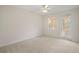 Bedroom with private balcony access and ceiling fan at 1736 Burgos Dr, Sarasota, FL 34238