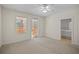 Light and airy bedroom with private balcony access and ensuite bathroom at 1736 Burgos Dr, Sarasota, FL 34238