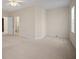 Spacious bedroom featuring carpet flooring and ensuite bathroom access at 1736 Burgos Dr, Sarasota, FL 34238