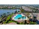 Resort-style pool with lounge chairs and palm trees at 1736 Burgos Dr, Sarasota, FL 34238