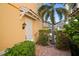 Front entrance with landscaping and brick walkway at 1736 Burgos Dr, Sarasota, FL 34238