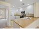 Modern kitchen with white cabinets and stainless steel appliances at 1736 Burgos Dr, Sarasota, FL 34238