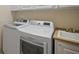 Laundry room with washer, dryer and utility sink at 1736 Burgos Dr, Sarasota, FL 34238