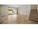 Living room with tiled floors, staircase, and view of the pool at 1736 Burgos Dr, Sarasota, FL 34238