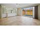 Spacious living room with tiled floors, pool view, and built-in wet bar at 1736 Burgos Dr, Sarasota, FL 34238