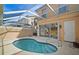 Private kidney-shaped pool with screened enclosure at 1736 Burgos Dr, Sarasota, FL 34238