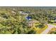 Aerial view of a home with a large lot and mature trees at 17402 Billiar Ave, Port Charlotte, FL 33948