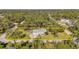 Aerial view of a single-Gathering home on a large lot with mature trees at 17402 Billiar Ave, Port Charlotte, FL 33948