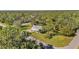 Aerial view of a single-Gathering home on a large lot with mature trees at 17402 Billiar Ave, Port Charlotte, FL 33948