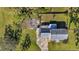 Aerial view of a home showcasing the backyard, patio, and surrounding landscape at 17402 Billiar Ave, Port Charlotte, FL 33948