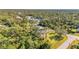 An aerial view showcasing a house on a spacious lot at 17402 Billiar Ave, Port Charlotte, FL 33948