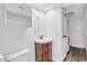 Small bathroom with wood vanity and built-in shelving at 17402 Billiar Ave, Port Charlotte, FL 33948