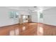 Large bedroom with hardwood floors and built-in mirrored vanity at 17402 Billiar Ave, Port Charlotte, FL 33948