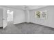 Bedroom with grey carpeting and an open door to another room at 17402 Billiar Ave, Port Charlotte, FL 33948