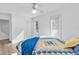 Bedroom with hardwood floors, a double bed, and access to a staircase at 17402 Billiar Ave, Port Charlotte, FL 33948