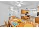 Dining area with light wood table and chairs, and access to kitchen at 17402 Billiar Ave, Port Charlotte, FL 33948